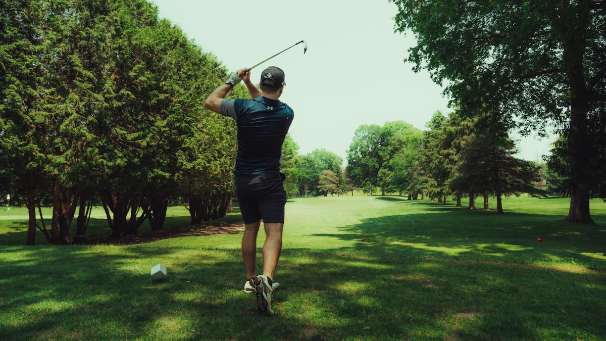 Golfer swinging on a championship course